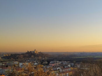 High angle view of townscape against clear sky during sunset