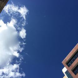Low angle view of building against blue sky