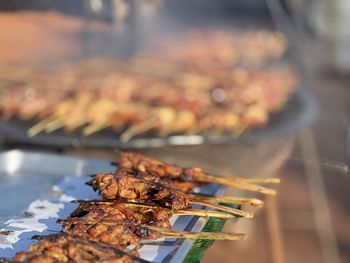 Close-up of meat on barbecue grill