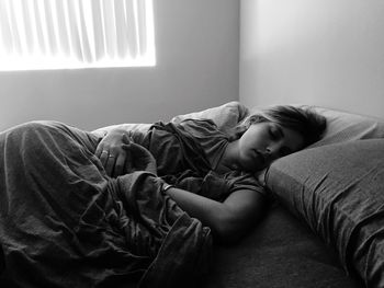 Man sleeping on sofa at home