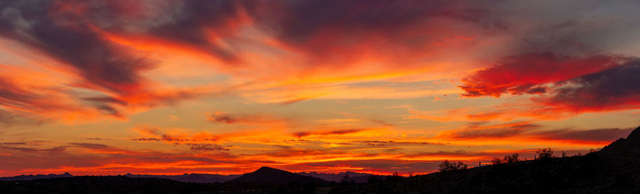 Scenic view of dramatic sky during sunset