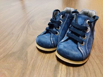 High angle view of shoes on wooden table