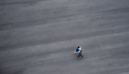 High angle view of men on man against sky