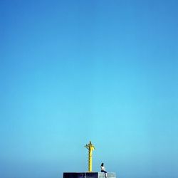 Low angle view of built structure against clear blue sky