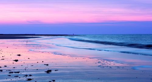 Scenic view of sea at sunset