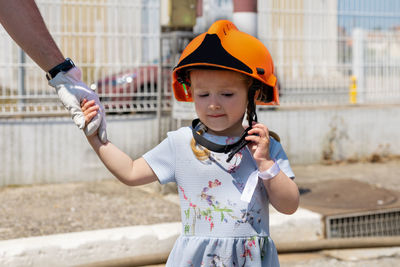 Father teaches his daughter firefighter training outdoor