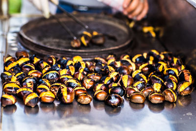 Close-up of person preparing food on table