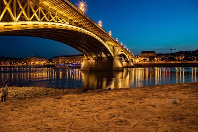 Bridge over river at night