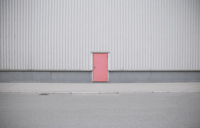 Red closed door of building