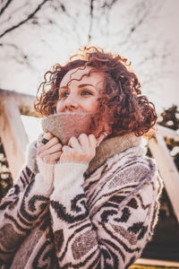 Young woman in warm clothing outdoors