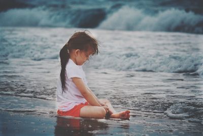 Full length of woman on sea shore