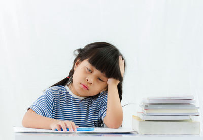 Portrait of a girl sitting on table