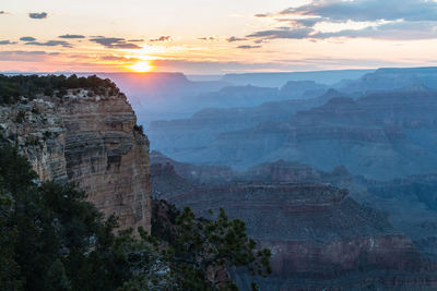 Scenic view of mountains against cloudy sky