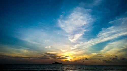 Scenic view of sea against cloudy sky