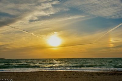 Scenic view of sea at sunset