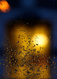 Full frame shot of wet glass window