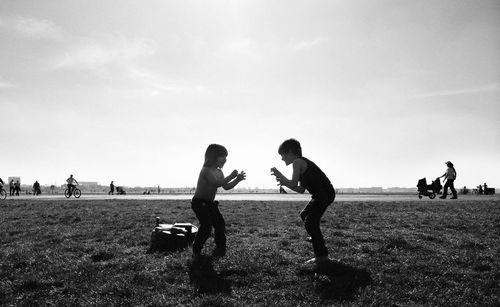 Boy playing with arms raised