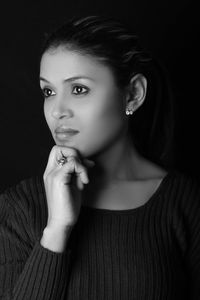 Close-up of young woman looking away