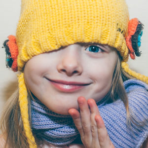 Close-up portrait of a smiling young woman