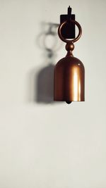 Close-up of lamp mounted on wall