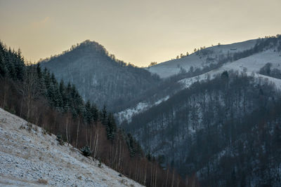 Scenic view of mountains against sky during winter