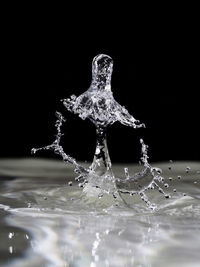 Close-up of water splashing on black background