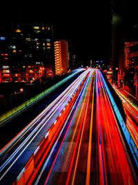 High angle view of light trails on road at night