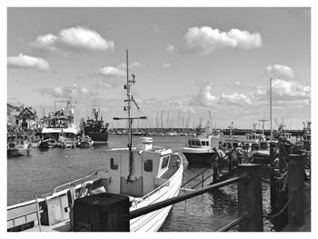 View of boats in calm sea against the sky