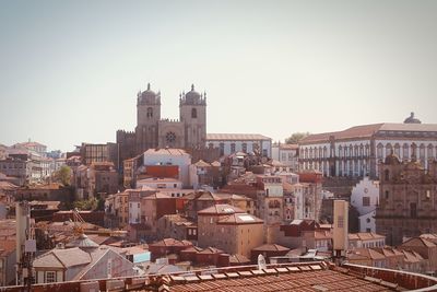 View of buildings in city against clear sky