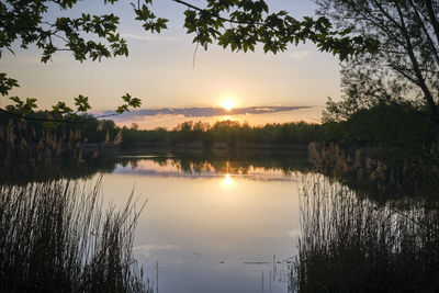 Scenic view of lake against sky during sunset
