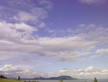 Scenic view of landscape against cloudy sky
