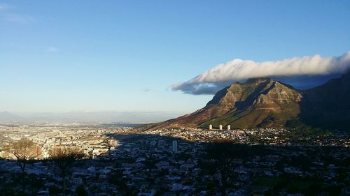 Clouds covering table mountain by residential district