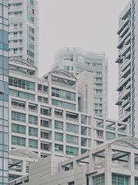 Low angle view of modern buildings against clear sky