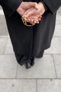 Low section of man standing on footpath