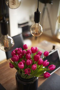 Close-up of pink flower vase on table