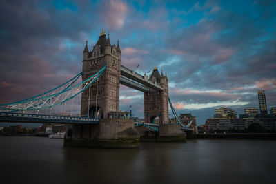 Tower bridge over thames river against sky