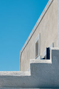 Low angle view of building against blue sky