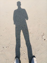 Shadow of man on sand