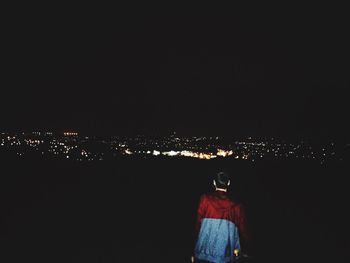 Man against sky at night