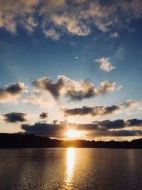 Scenic view of lake against sky during sunset