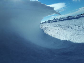 Scenic view of sea against sky during winter