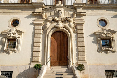 A amazing design of the door and window to the entrance of this wonderful home in the heart of rome 
