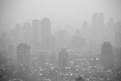 High angle view of buildings in city against sky