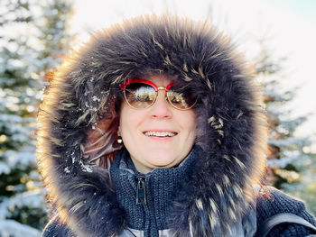 Portrait of young woman in warm clothing