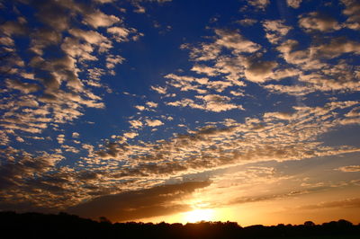 Low angle view of dramatic sky during sunset