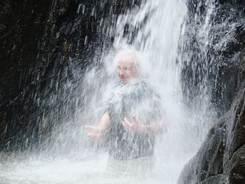 Man enjoying waterfall