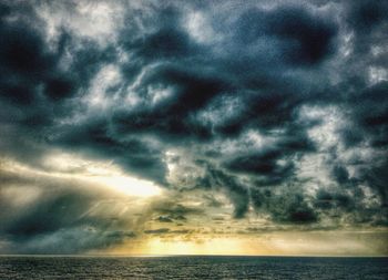 Scenic view of sea against cloudy sky