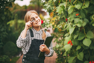 Young woman using mobile phone outdoors