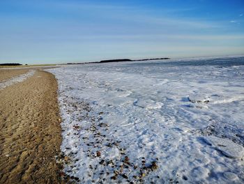 Scenic view of sea against sky during winter