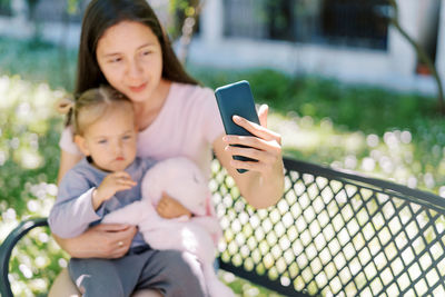 Young woman using mobile phone